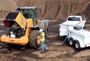 Using a dedicated bulk DEF trailer, a technician services a wheel loader. Photos courtesy of Thunder Creek Equipment