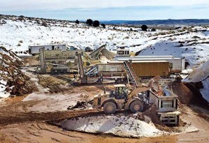 A wheel loader feeds 12-in.-minus bank material into a Lippmann primary jaw crusher. Photos courtesy of Elam Construction