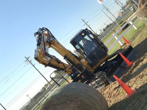 The Mini Hydraulic Excavator Universal Coupler weights 286 pounds and allows users to pick up a wider range of attachments. Photo courtesy of Caterpillar.