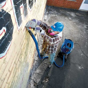 OSHA’s new silica rule is prompting employers in construction to turn to solutions such as vacuum dust-collection systems for tasks like tuckpointing. What sorts of dust-collecting solutions might aggregate operations turn to should a new MSHA silica rule come to life? Photo courtesy of Tech Image