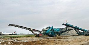 With planes circling the jobsite, Independence Excavating’s crew members must be aware of their surroundings at all times. Photo courtesy of Linda Reinert, TimeLine Photography