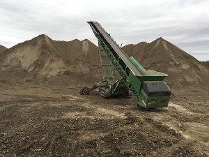 McCloskey's all-terrain stackers are easily moved site to site without the need to remove the wheels. Photo courtesy of McCloskey International.