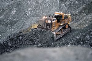 Cat D11T dozers are crucial to the Krupp’s production, pushing fragmented granite toward the mouth of the colossal crusher. Photo by Aaron Witt.