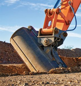 Angle tilt buckets offer operators the ability to easily grade or level an area without having to reposition the excavator as frequently. Photo courtesy of Two Rivers Marketing.