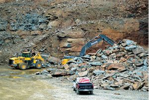 Operating in an old dimensional stone quarry, Quarry Management was blasting rather than ripping when Portable Plants visited this summer. Photo by Kevin Yanik
