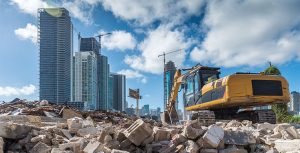 Heavy machinery cleans a rubble site for a new housing development site in Miami. Photo: CHUYN/iStock / Getty Images Plus/Getty Images