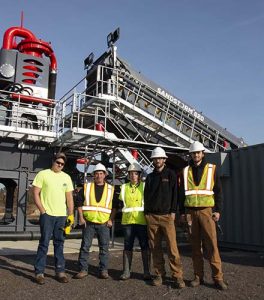 Pictured here from Arms Sand & Gravel are Jimmy Rowland (far left) and Bridgette Moss (center). Maverick Enviromental Equipment is represented by Tim Smith (second from left), Damon Daugherty (second from right) and Dave Matchinga (far right). Photo: Portable Plants Staff