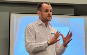Ben Frettsome, product line director of MWS Equipment, addresses the trade press during his company's AGG1 press conference. Photo: Portable Plants Staff